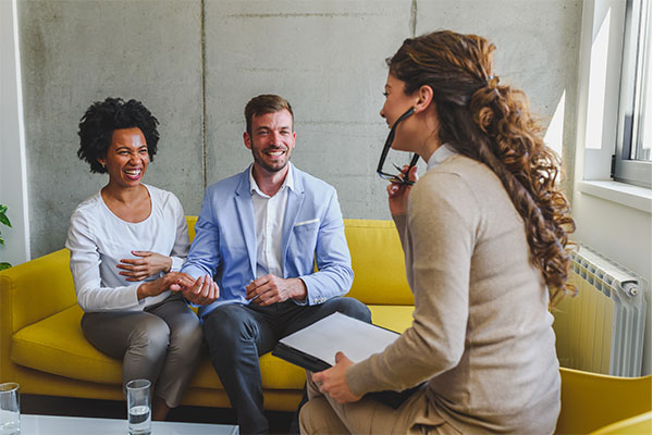 Broker working with a couple on a dental plan.